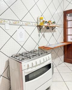 A kitchen or kitchenette at Hostel das fadas