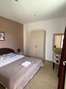 a bedroom with a bed with two towels on it at Apartmani Jaz 24 in Budva +45 photos