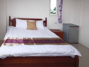 Letto o letti in una camera di Village Tree B&B