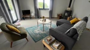 a living room with a couch and a table at Quinta da Luena in Candemil