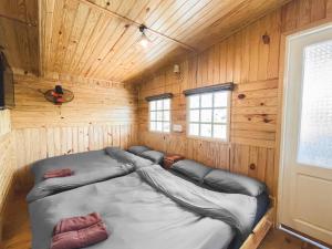 Postel nebo postele na pokoji v ubytování Ziczac Homestay Đà Lạt