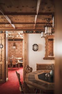 a room with a table and a dining room with a table and chairs at Sporthotel Bachmann in Gargellen