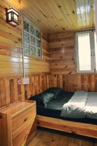 Postel nebo postele na pokoji v ubytování Ziczac Homestay Đà Lạt