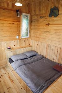 Postel nebo postele na pokoji v ubytování Ziczac Homestay Đà Lạt