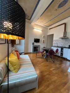 a living room with a couch and a table at Scala Apartments in Florence