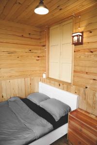 Postel nebo postele na pokoji v ubytování Ziczac Homestay Đà Lạt