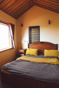 Postel nebo postele na pokoji v ubytování Ziczac Homestay Đà Lạt