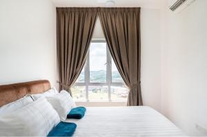 a bedroom with a bed with a large window at Residensi Ostia by ZUJ in Bandar Baru Bangi