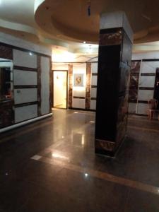 a large room with a lobby with a pillar in it at شقة مفروشة لك وحدك قريبة من مكتبة الاسكندرية in Alexandria