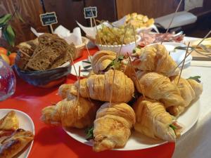a plate of croissants and other pastries on a table at Villa Luisa in Ziano Piacentino