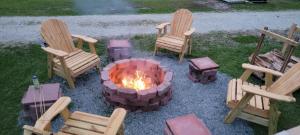 a group of chairs around a fire pit at Carolyn's Lighthouse Topsail Island in Sneads Ferry