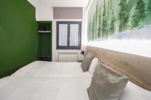 Voodi või voodid majutusasutuse Glaner Hotel Cafe toas