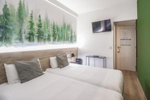 Voodi või voodid majutusasutuse Glaner Hotel Cafe toas
