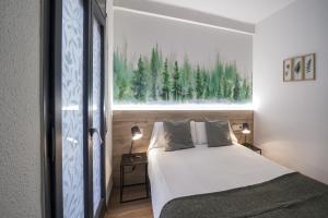 Voodi või voodid majutusasutuse Glaner Hotel Cafe toas