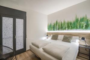 Voodi või voodid majutusasutuse Glaner Hotel Cafe toas
