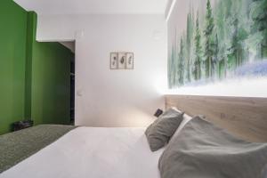Voodi või voodid majutusasutuse Glaner Hotel Cafe toas