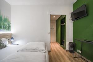 Voodi või voodid majutusasutuse Glaner Hotel Cafe toas