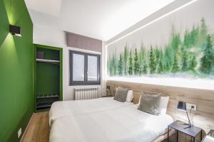 Voodi või voodid majutusasutuse Glaner Hotel Cafe toas