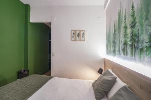 Voodi või voodid majutusasutuse Glaner Hotel Cafe toas