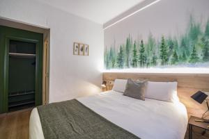 Voodi või voodid majutusasutuse Glaner Hotel Cafe toas