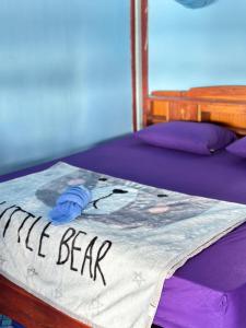 a bed with the words my bear written on it at Happy bangalow riverside in Muang Không