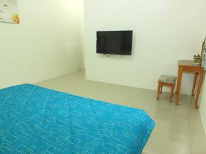 TV o dispositivi per l'intrattenimento presso Village Tree B&B