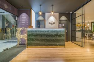 a store front with a brick wall at Glaner Hotel Cafe in Andorra la Vella