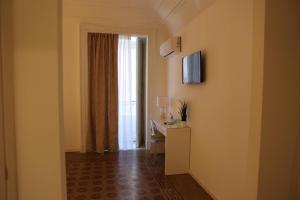 a hotel room with a hallway with a window at Boutique Rooms B&B in Catania