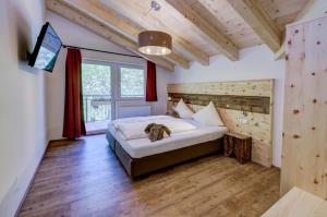 Postel nebo postele na pokoji v ubytování Berghotel Jaga-Alm