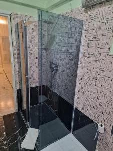 a shower with a glass door in a bathroom at B&B Cavaliere in Milan