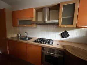 a kitchen with a sink and a stove top oven at Appartamento in centro a Spoleto in Spoleto
