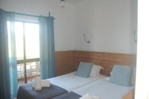 CASA DA HORTA客房内的一张或多张床位