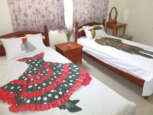 Letto o letti in una camera di Village Tree B&B
