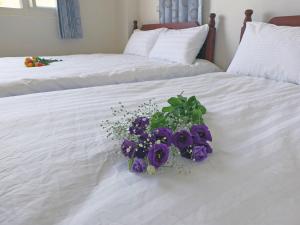 Letto o letti in una camera di Village Tree B&B