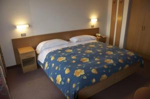 Postel nebo postele na pokoji v ubytování Hotel Sciatori
