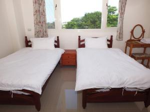 Letto o letti in una camera di Village Tree B&B