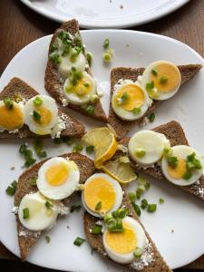 a white plate with eggs on top of toast at Oasi in Kato Loutraki