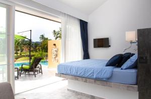 Postel nebo postele na pokoji v ubytování Villa Manao - Koh Chang