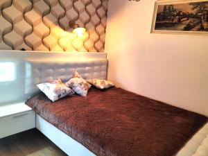 Кровать или кровати в номере Złoty Kłos