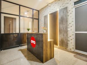an office lobby with a stop sign on a counter at Super OYO Silver Sky in Ludhiana