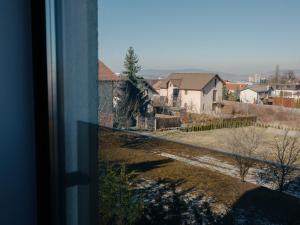 a view of a house from a window at Ionesco Apartments in Cluj-Napoca