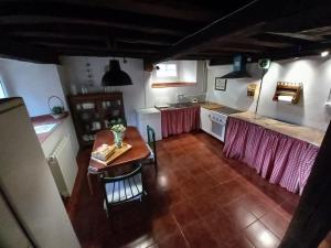 an overhead view of a kitchen with a table at El Callejo de Abiada in Abiada