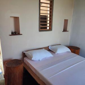 Uma cama ou camas num quarto em KIBA HOTEL