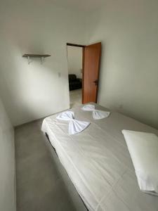 Katil atau katil-katil dalam bilik di Casa para Temporada - Recém Reformada