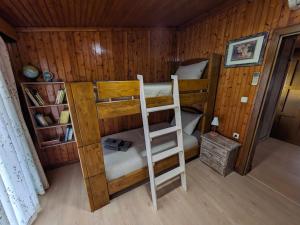 a room with two bunk beds in a cabin at Sea View Roof Garden in Kiáton