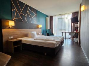 Postel nebo postele na pokoji v ubytování Hotel Luise Mannheim - by SuperFly Hotels