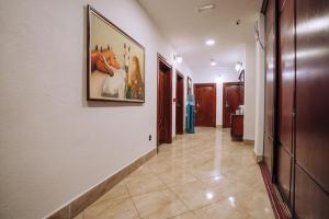 a hallway with a painting of animals on the wall at Lihnidos Square in Ohrid