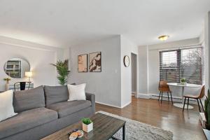 a living room with a couch and a table at Chic & Cozy 1BR Apt in Chicago - Hyde Park 408 in Chicago