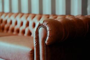 a close up of a brown leather couch at Campo Abierto in Rivera