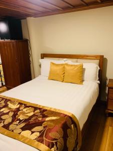 Ліжко або ліжка в номері Magdalena Hotel & Suites